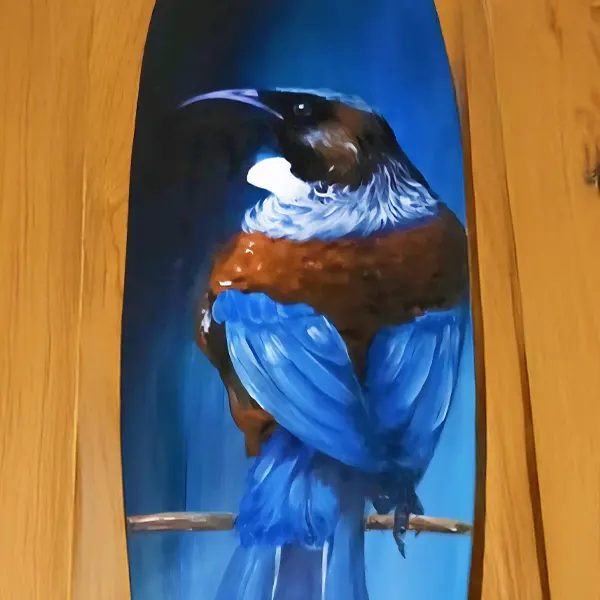 A tui painted on a skateboard